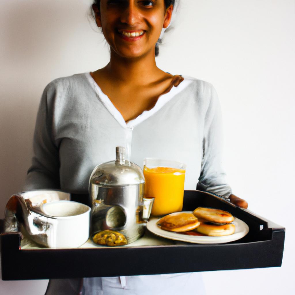 Person holding breakfast tray, smiling