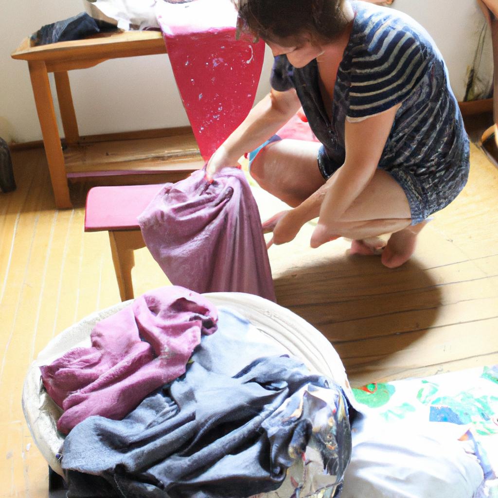 Person folding laundry at B&B