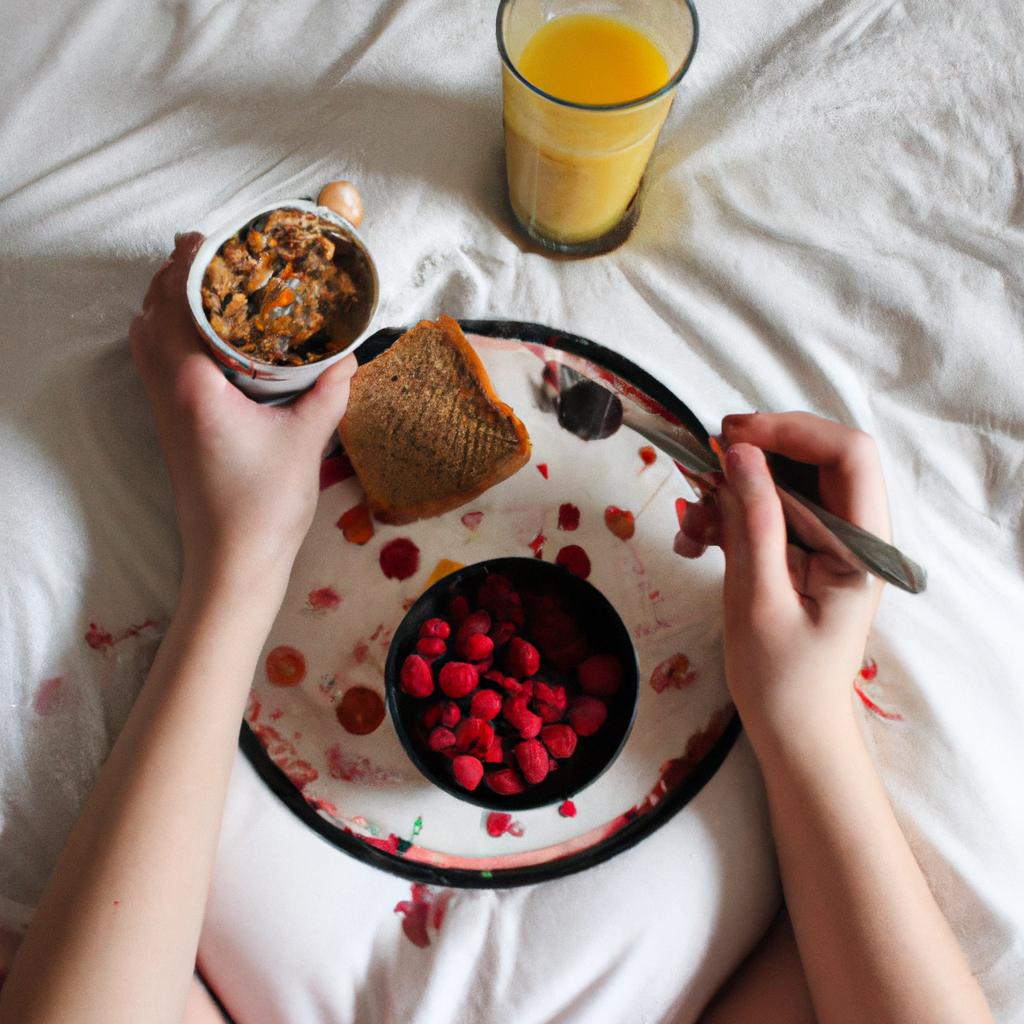 Person eating breakfast in bed